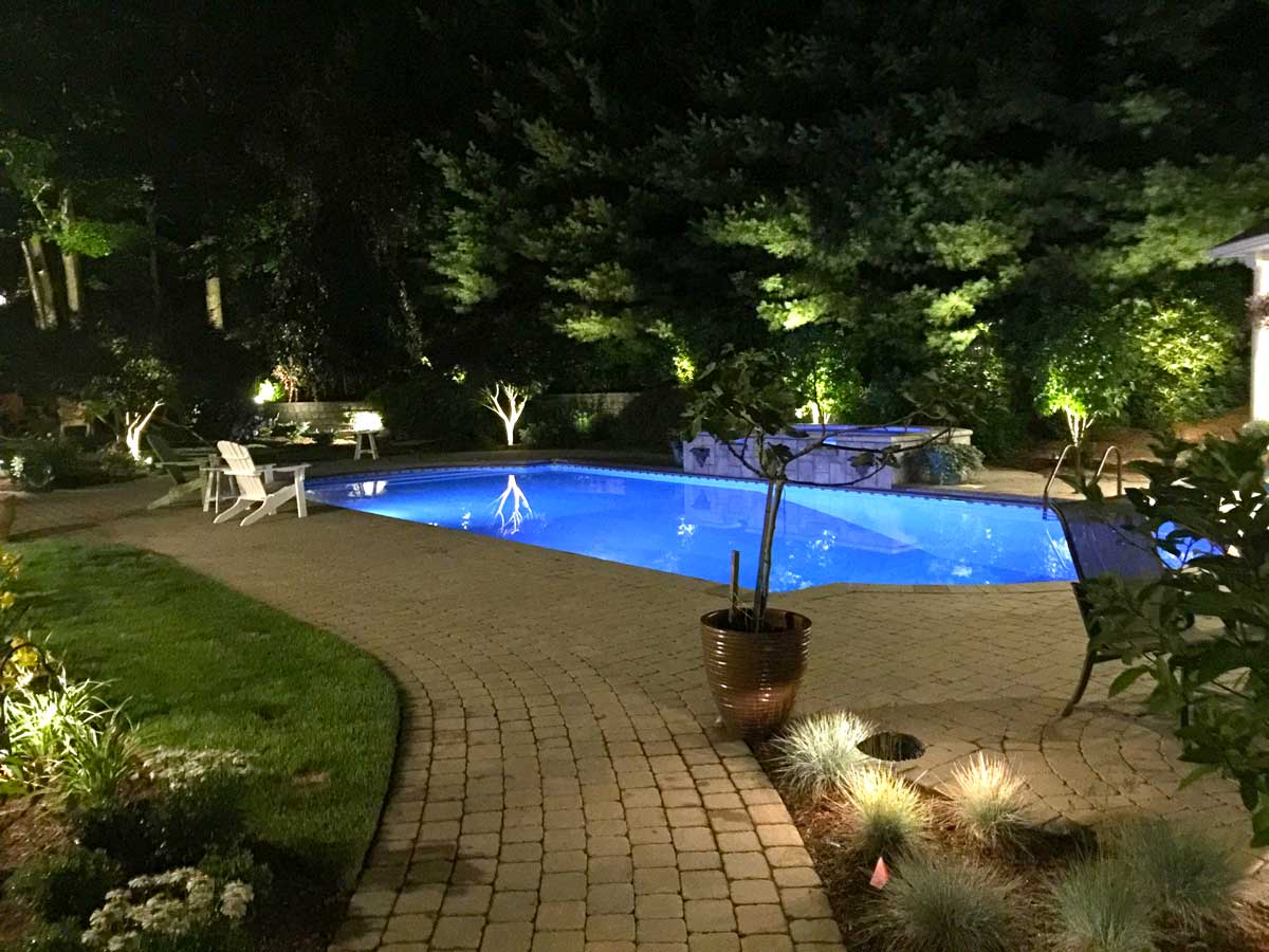 in the ground pool at night