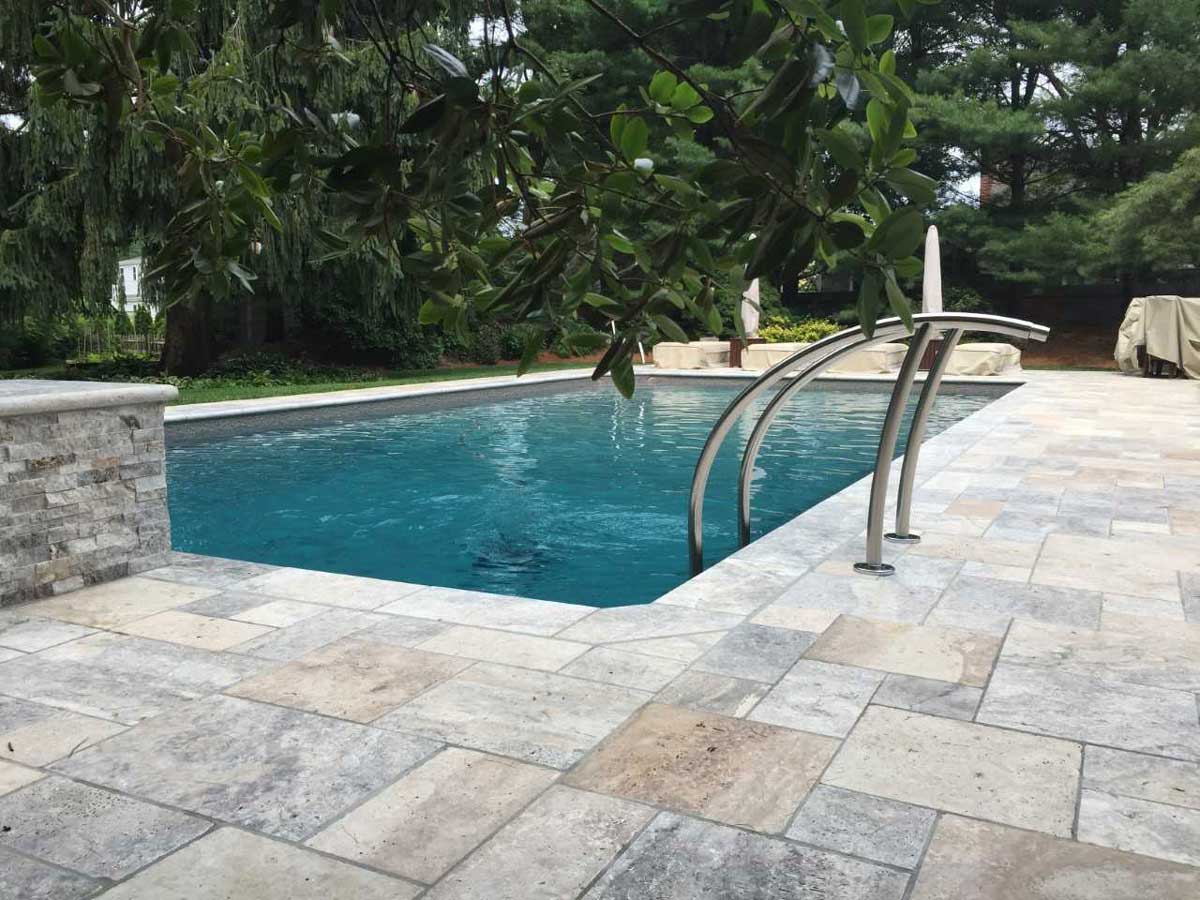 in ground pool with new patio